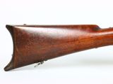 an old wooden rifle on a white background