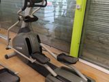 two stationary exercise bikes in a gym room