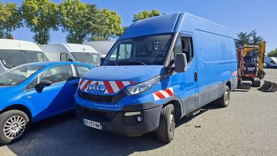 a blue van that is parked next to a blue car