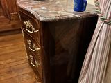 a table with a lamp on top of it in a room