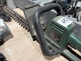a picture of a chainsaw sitting on top of a table
