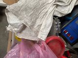 a pile of clothes and other items in a room