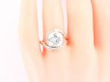 an image of a woman ' s hand with a diamond ring on it