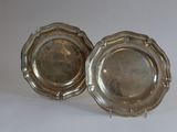 pair of silver plated dishes on stand on white background