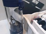 a blender that is sitting on a table next to other items