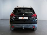 a picture of a black car parked in a showroom