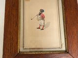 une image représentant un tableau d'un homme jouant au golf, dans un cadre en bois