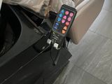 a remote control on the seat of a car
