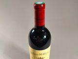 a bottle of wine that is sitting on a table