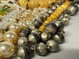 a lot of beads that are laying on a table