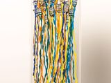 a picture of a display of colorful ribbons on a shelf