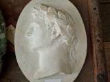 a white plate with a picture of a woman on it