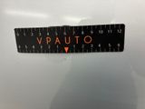 a close up of a sticker with the word vauto on it