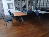 a room with a table and chairs in it