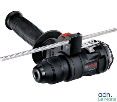the black and decker electric driller is being used to cut a piece of metal