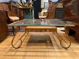 a glass table that is sitting on a wooden floor