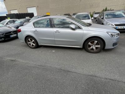 a silver car that is parked in a parking lot