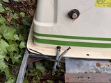 a small machine that is sitting in the grass
