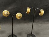 three pairs of gold earrings and a pair of gold ear rings