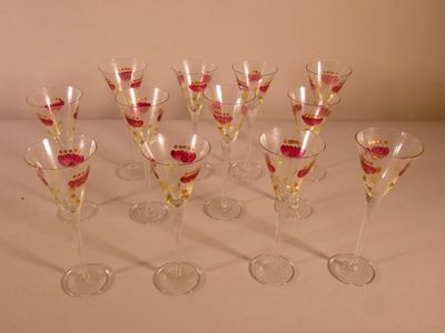 a lot of wine glasses sitting on a table