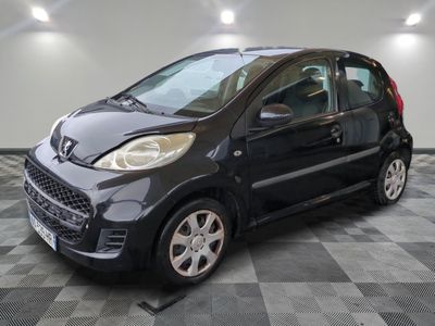 a picture of a small black car on a checkered floor