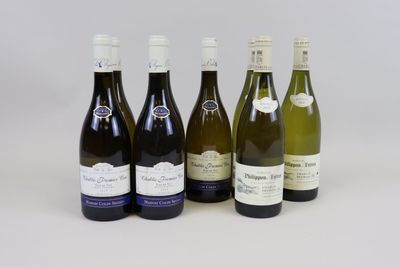 six bottles of wine are lined up on a white surface
