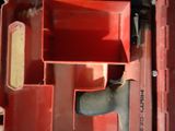a red tool box with tools in it on the floor