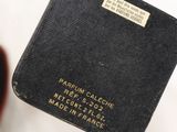 a black wallet that has a gold label on it