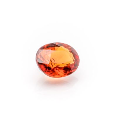 an orange sapphire stone on a white background