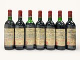 six bottles of red wine lined up in a row
