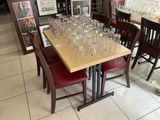 many empty glasses on a table in a restaurant