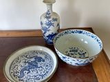 a blue and white bowl and a plate on a table