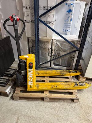 a pallet with a fork on a pallet in a warehouse