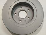 an image of a close up of a brake disc on a white surface
