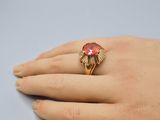 an image of a woman ' s hand with a ring on it ' s finger