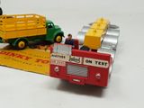 two toy trucks that are sitting on top of a box