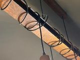 three lights that are hanging from the ceiling in the room