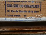 a close up of a label on a piece of wood