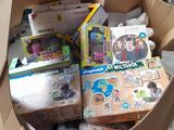 a cardboard box full of toys in a warehouse