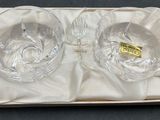 two clear glass bowls in a white box on a table