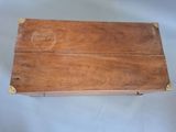 a wooden box that has a handle on it
