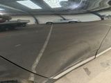 a reflection of a car in a mirror on the side of a car