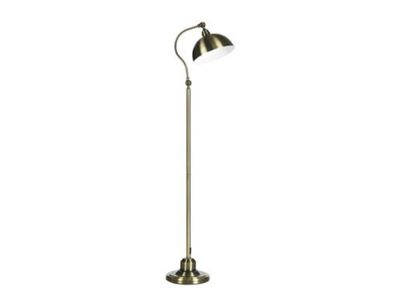 Le lampadaire est doté d'un pied en métal et d'un abat-jour blanc