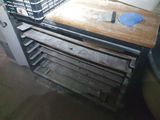 a wooden table with a bunch of dishes on it