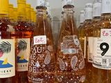 several bottles of alcohol are lined up on a counter