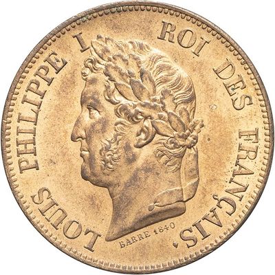 a close up of a coin with a man ' s head on it