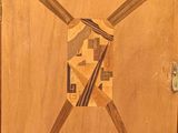 a picture of a wooden door with a design on it
