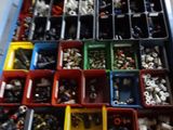 many bins filled with different types of screws and nuts
