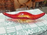 a glass bowl sitting on a table in a room