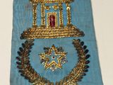 a blue tie with a gold and red design on it